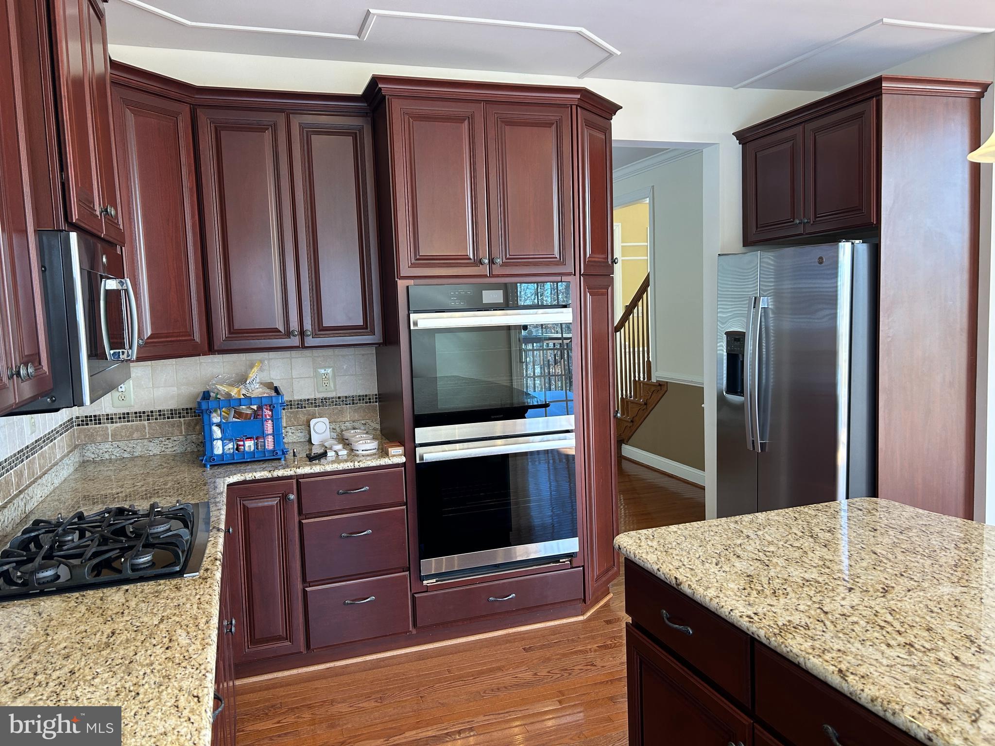 310 Waynebrook Drive Chester Springs, PA 19425 - Photo 30 of 39 a kitchen with stainless steel appliances granite countertop a refrigerator and a stove top oven