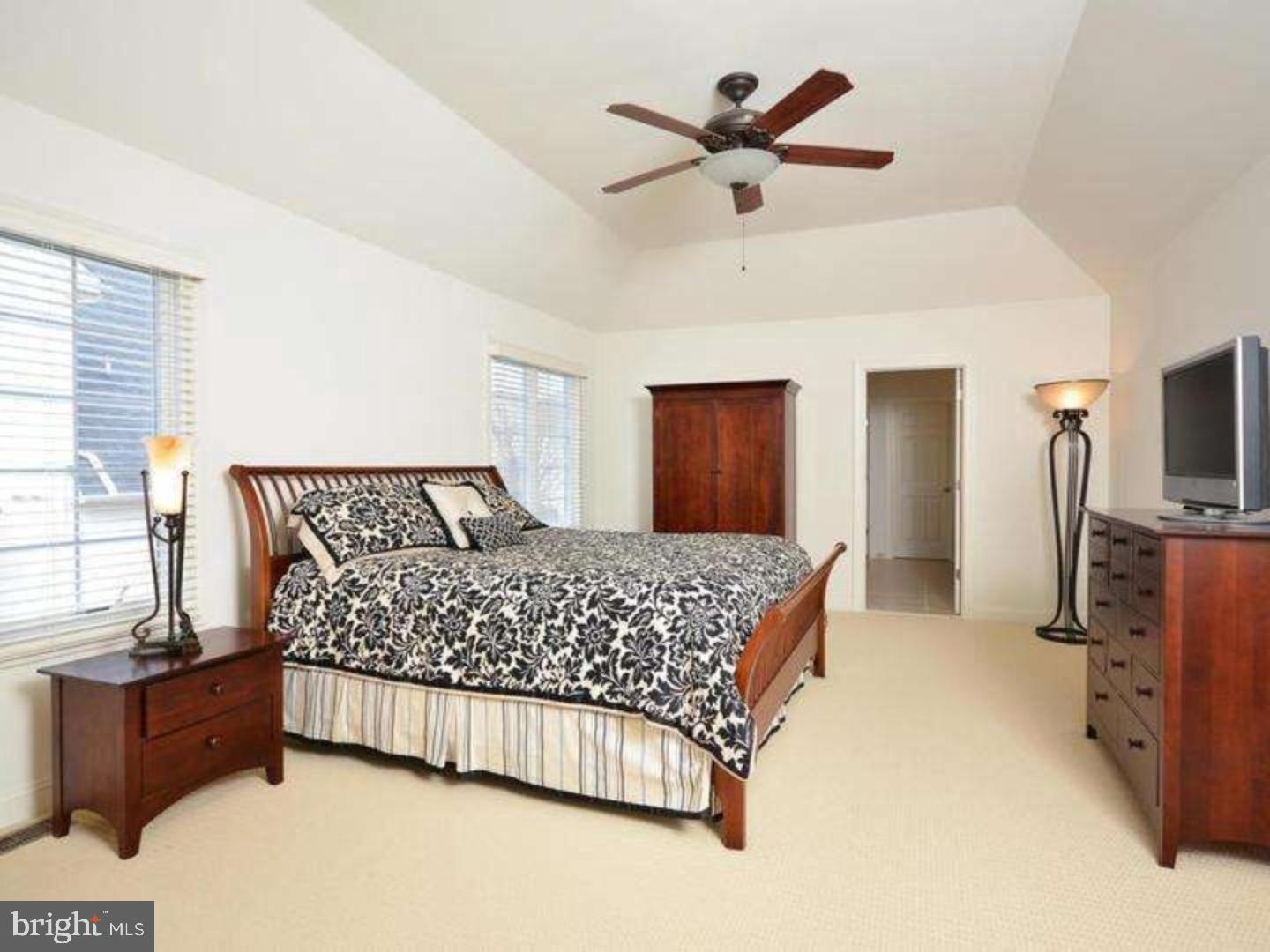 310 Waynebrook Drive Chester Springs, PA 19425 - Photo 3 of 39 a bedroom with a large bed and a chandelier