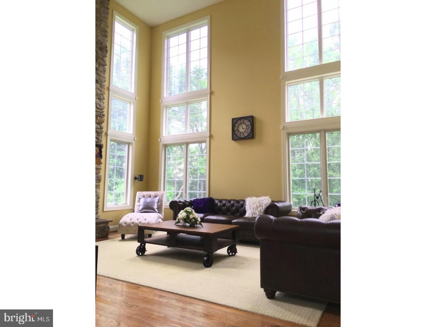 310 Waynebrook Drive Chester Springs, PA 19425 - Photo 9 of 39 a living room with furniture and floor to ceiling windows
