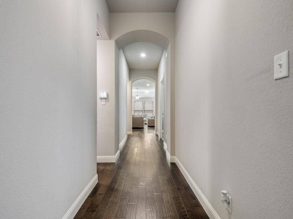 1313 Torrington Lane Forney, TX 75126 - Photo 14 of 40 a view of a hallway with wooden floor