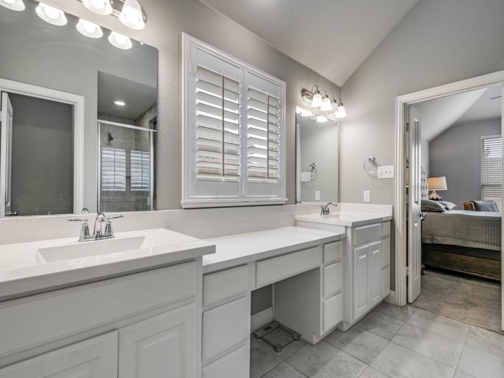 1313 Torrington Lane Forney, TX 75126 - Photo 20 of 40 a bathroom with a double vanity sink a mirror and a bathtub