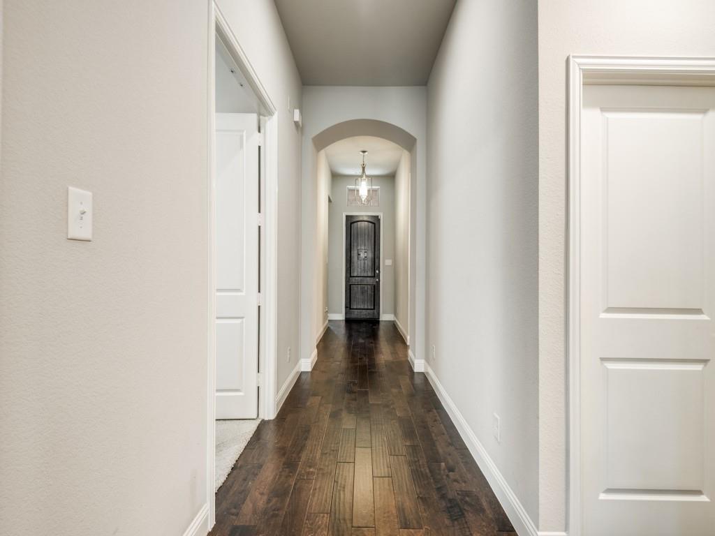 1313 Torrington Lane Forney, TX 75126 - Photo 22 of 40 a view of a hallway with wooden floor