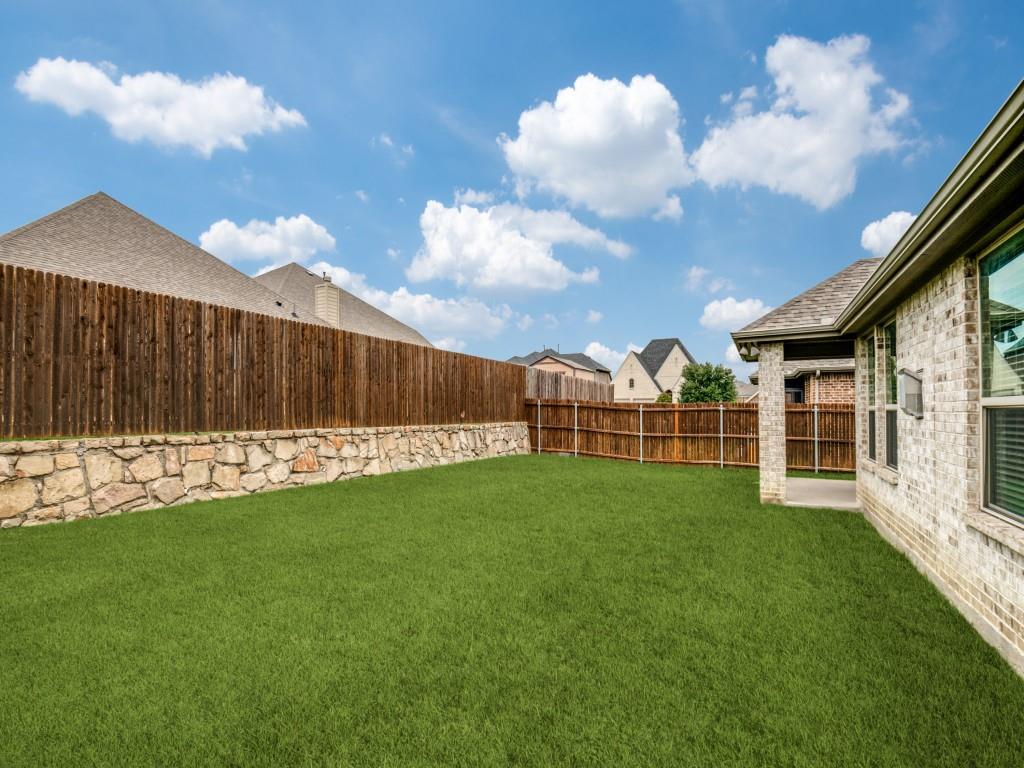 1313 Torrington Lane Forney, TX 75126 - Photo 39 of 40 a view of a backyard with a garden