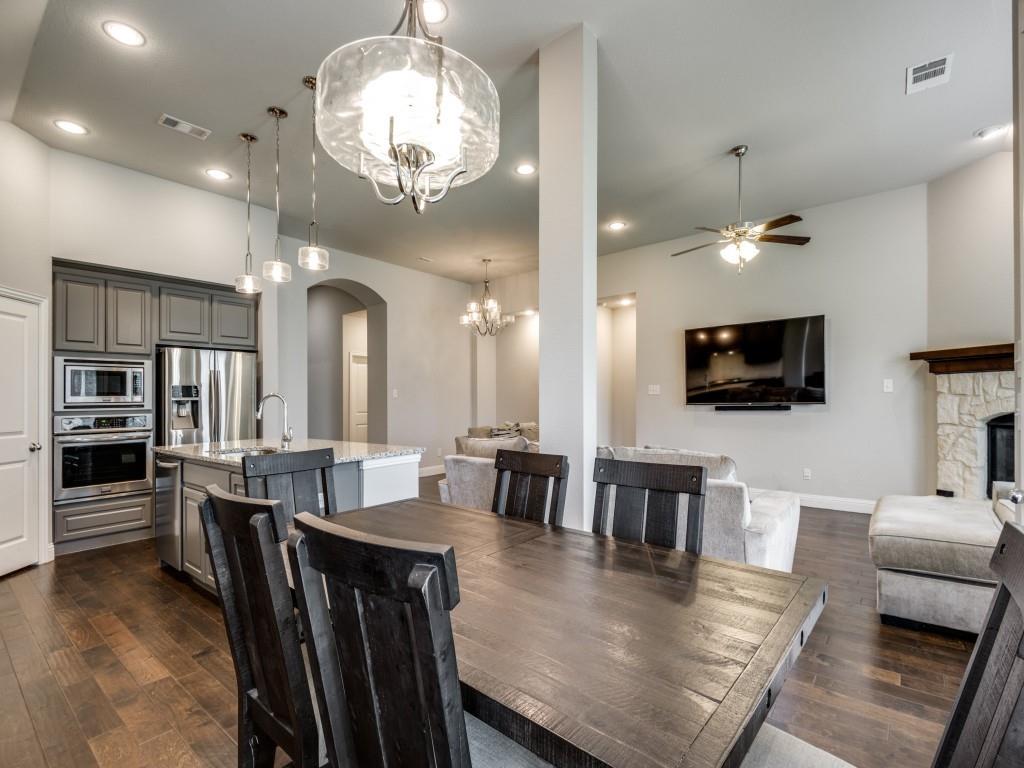1313 Torrington Lane Forney, TX 75126 - Photo 4 of 40 a large kitchen with a table and chairs