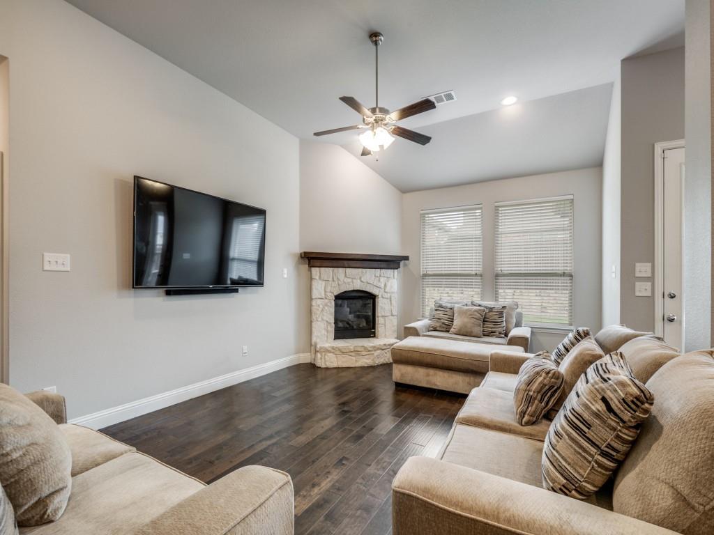 1313 Torrington Lane Forney, TX 75126 - Photo 7 of 40 a living room with furniture fireplace and flat screen tv