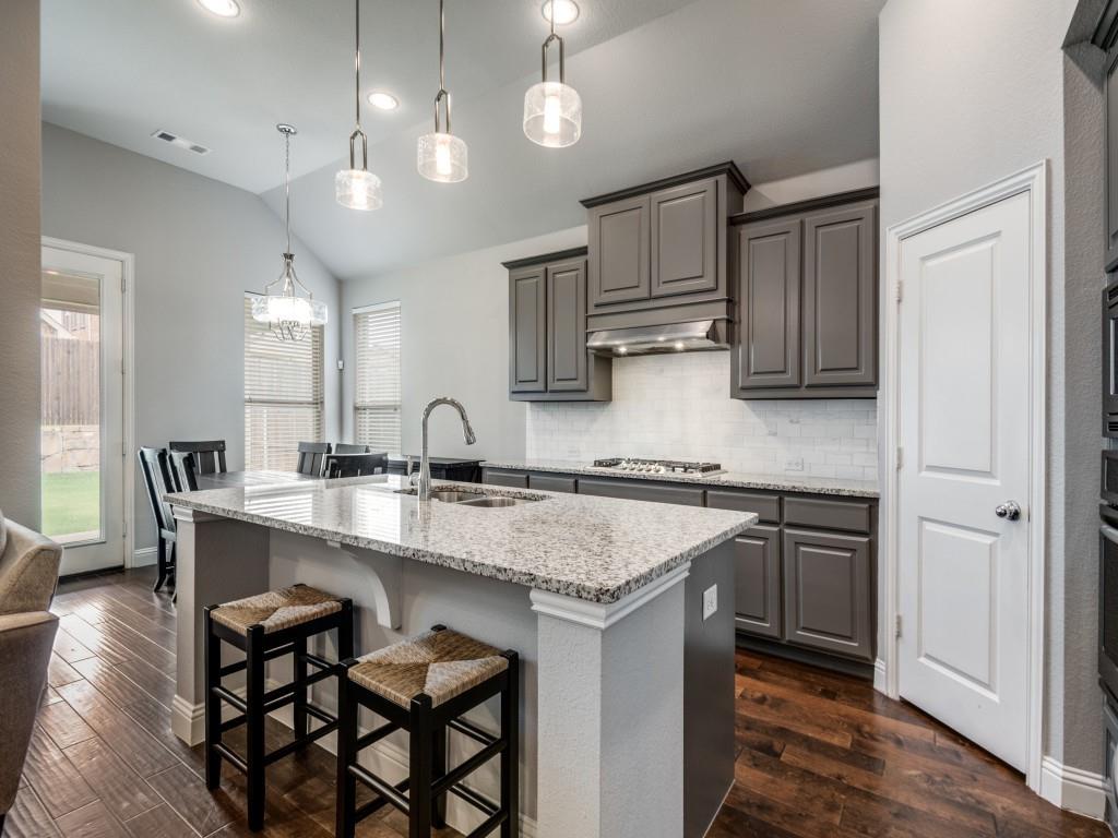 1313 Torrington Lane Forney, TX 75126 - Photo 9 of 40 a kitchen with a sink cabinets and wooden floor