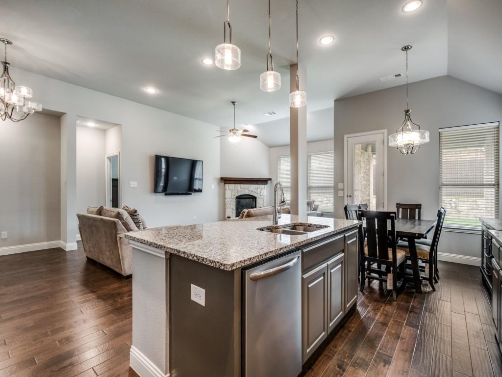 1313 Torrington Lane Forney, TX 75126 - Photo 40 of 40 a kitchen with sink stove top oven and microwave
