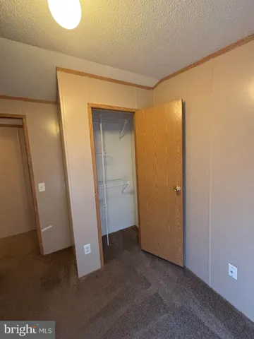 an empty room with wooden door
