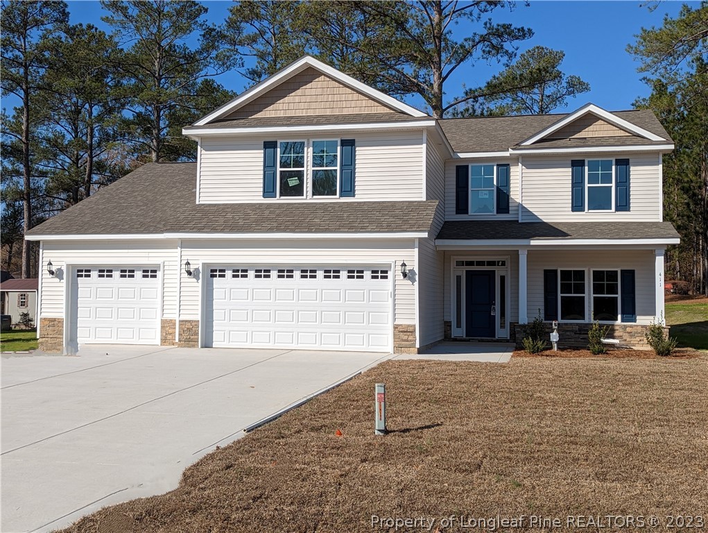 411 B & B Loop Road Raeford, NC 28376 - Photo 1 of 47 a front view of a house with a yard and garage