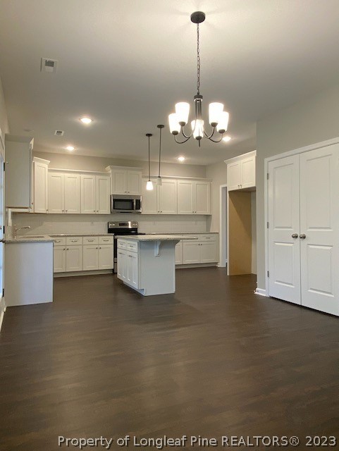 411 B & B Loop Road Raeford, NC 28376 - Photo 12 of 47 a view of a kitchen with a sink stainless steel appliances and cabinets