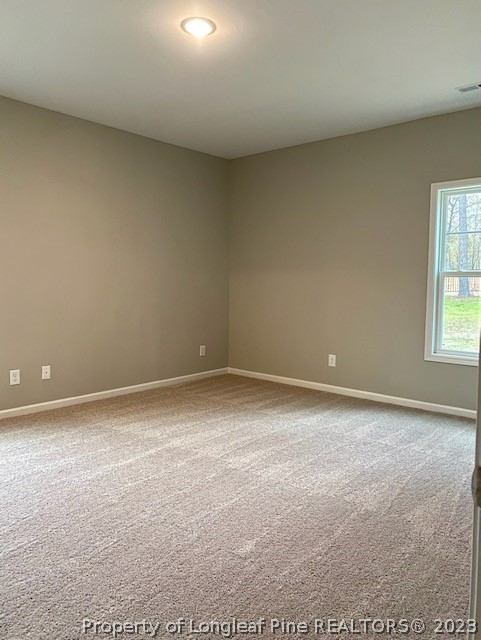 411 B & B Loop Road Raeford, NC 28376 - Photo 16 of 47 an empty room with windows