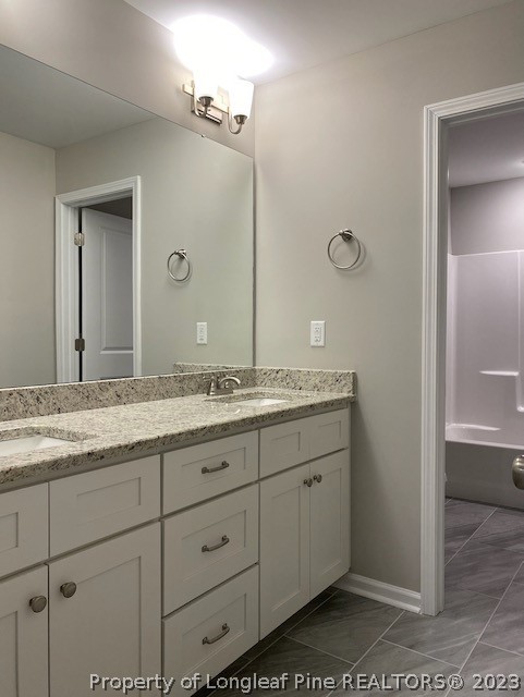 411 B & B Loop Road Raeford, NC 28376 - Photo 24 of 47 a bathroom with a granite countertop sink and a mirror