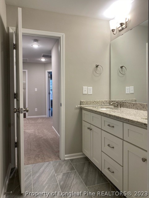 411 B & B Loop Road Raeford, NC 28376 - Photo 26 of 47 a spacious bathroom with a granite countertop sink mirror and shower