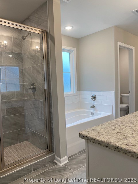 411 B & B Loop Road Raeford, NC 28376 - Photo 32 of 47 a bathroom with a granite countertop bathtub shower sink and mirror