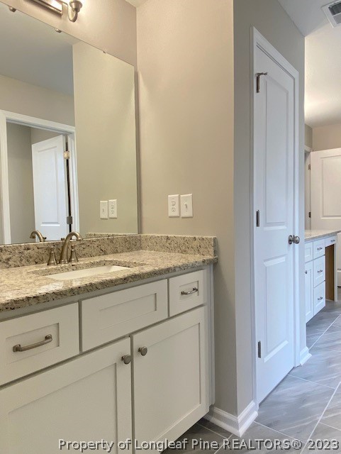 411 B & B Loop Road Raeford, NC 28376 - Photo 36 of 47 a bathroom with a granite countertop sink and a mirror