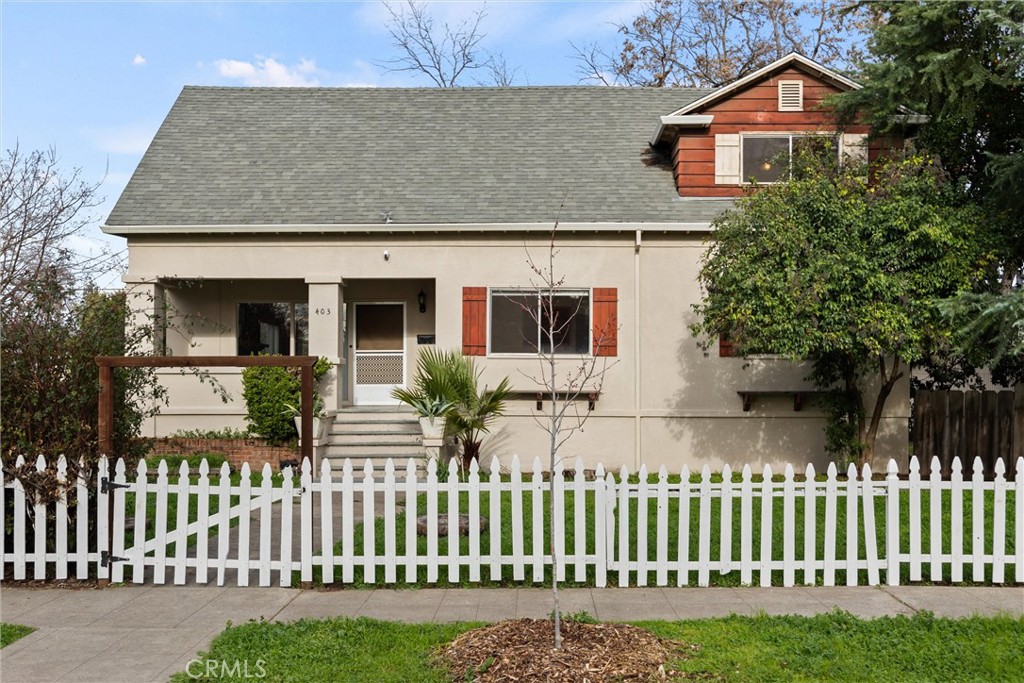 a front view of a house with wooden fence