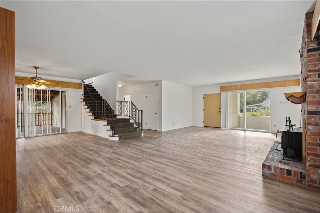 403 Ash Street Chico, CA 95928 - Photo 11 of 52 a view of an empty room with wooden floor and a window