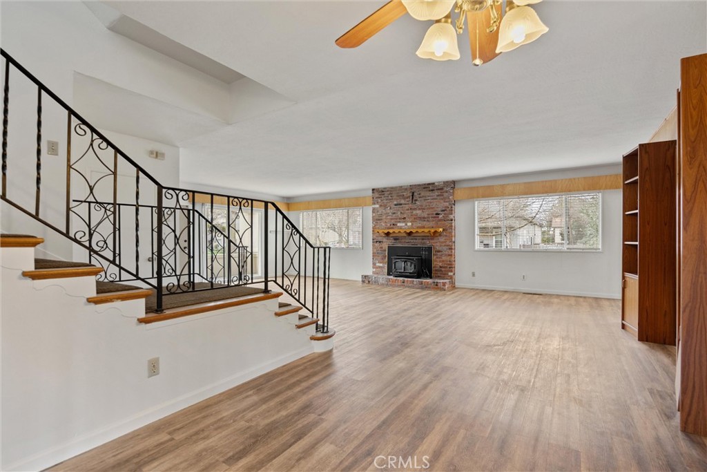 403 Ash Street Chico, CA 95928 - Photo 12 of 52 a view of an empty room with wooden floor and floors