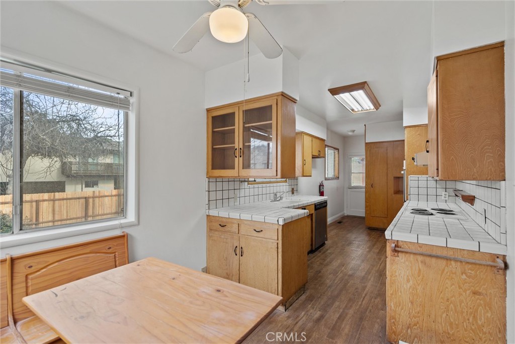 403 Ash Street Chico, CA 95928 - Photo 18 of 52 a kitchen with a stove a sink a counter top space and living room view