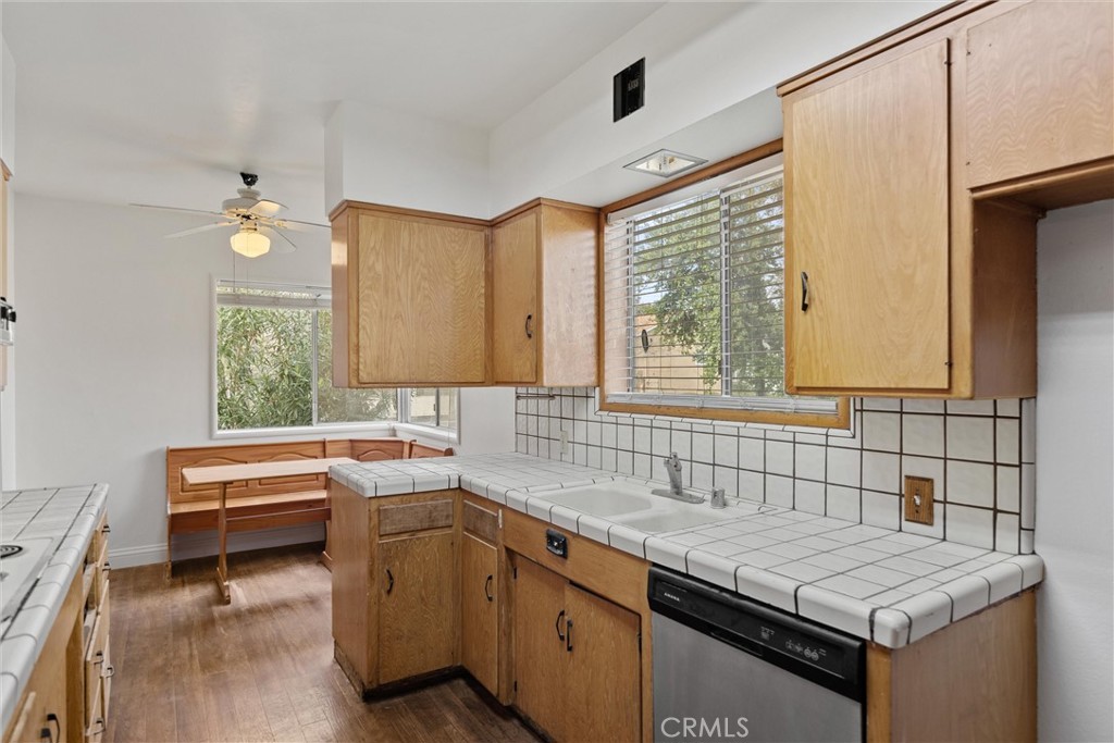 403 Ash Street Chico, CA 95928 - Photo 20 of 52 a kitchen that has a sink a chair and a stove in it
