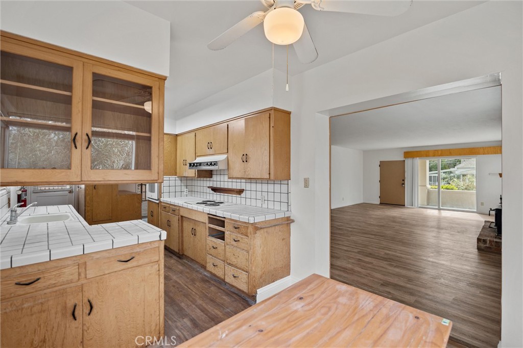 403 Ash Street Chico, CA 95928 - Photo 24 of 52 a kitchen with a stove and a wooden floors