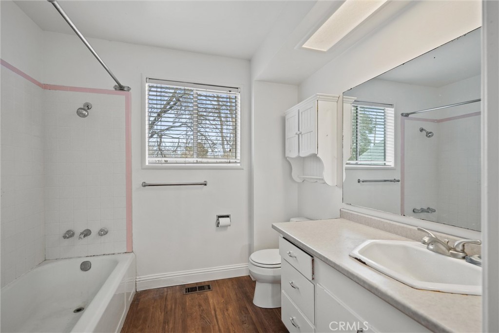 403 Ash Street Chico, CA 95928 - Photo 27 of 52 a bathroom with a sink a toilet and shower