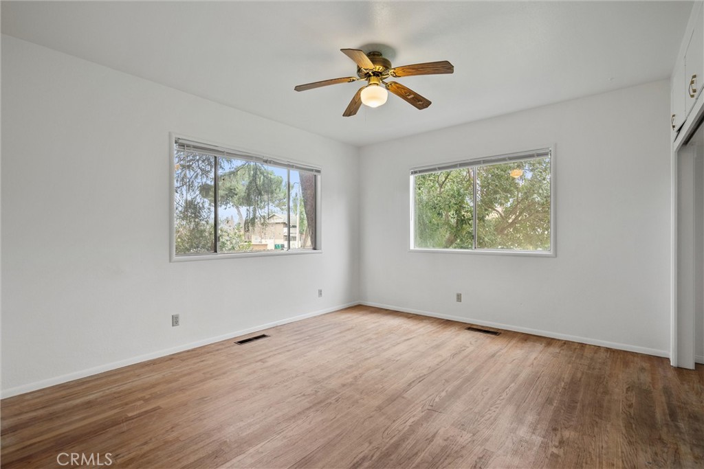 403 Ash Street Chico, CA 95928 - Photo 31 of 52 a view of empty room with wooden floor and window