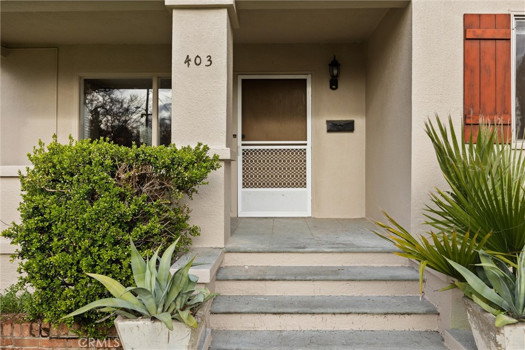 403 Ash Street Chico, CA 95928 - Photo 6 of 52 a front view of a house with a garden