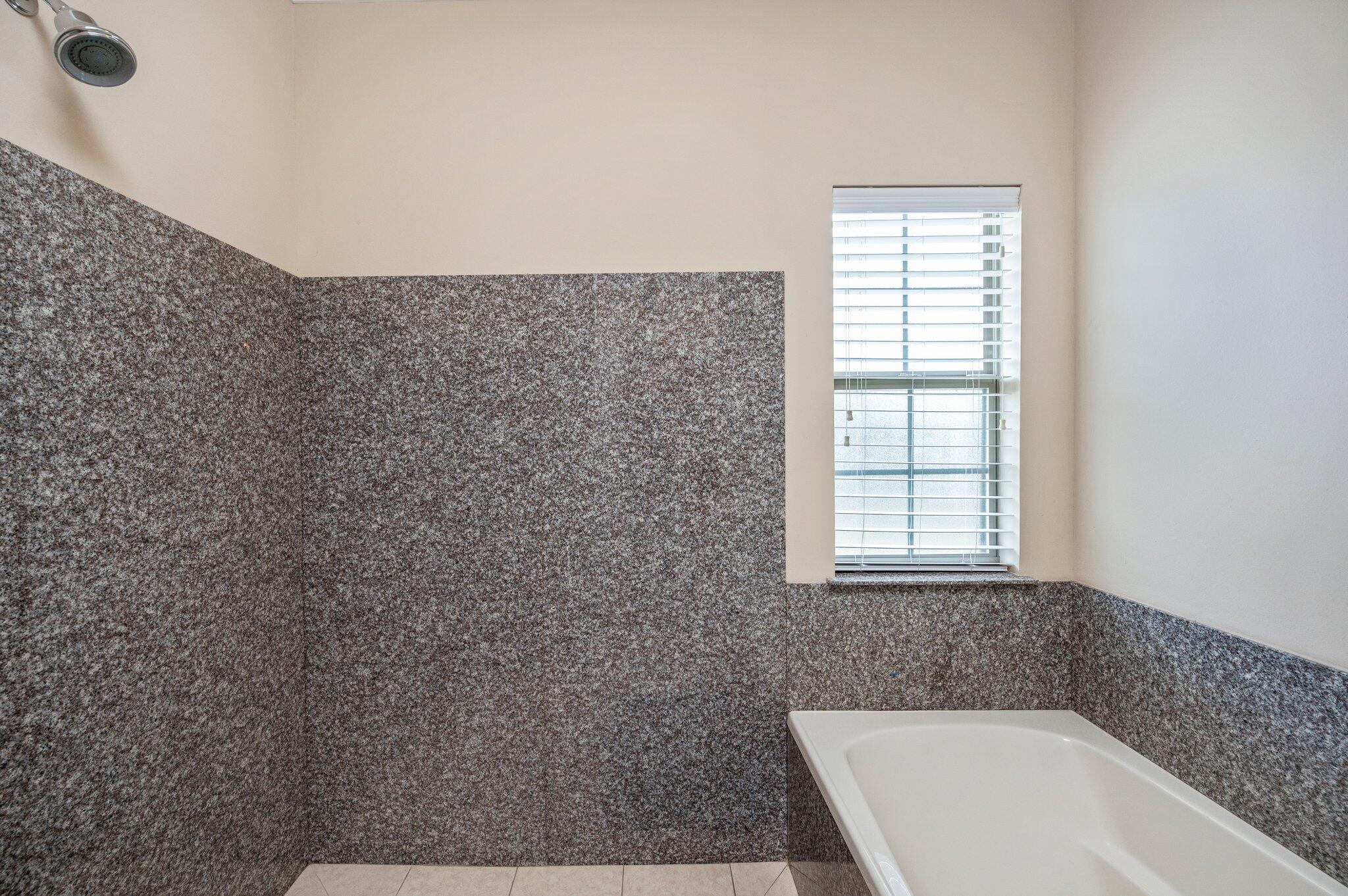 5231 Moore Loop Crestview, FL 32536 - Photo 19 of 45 a bathroom with a bathtub