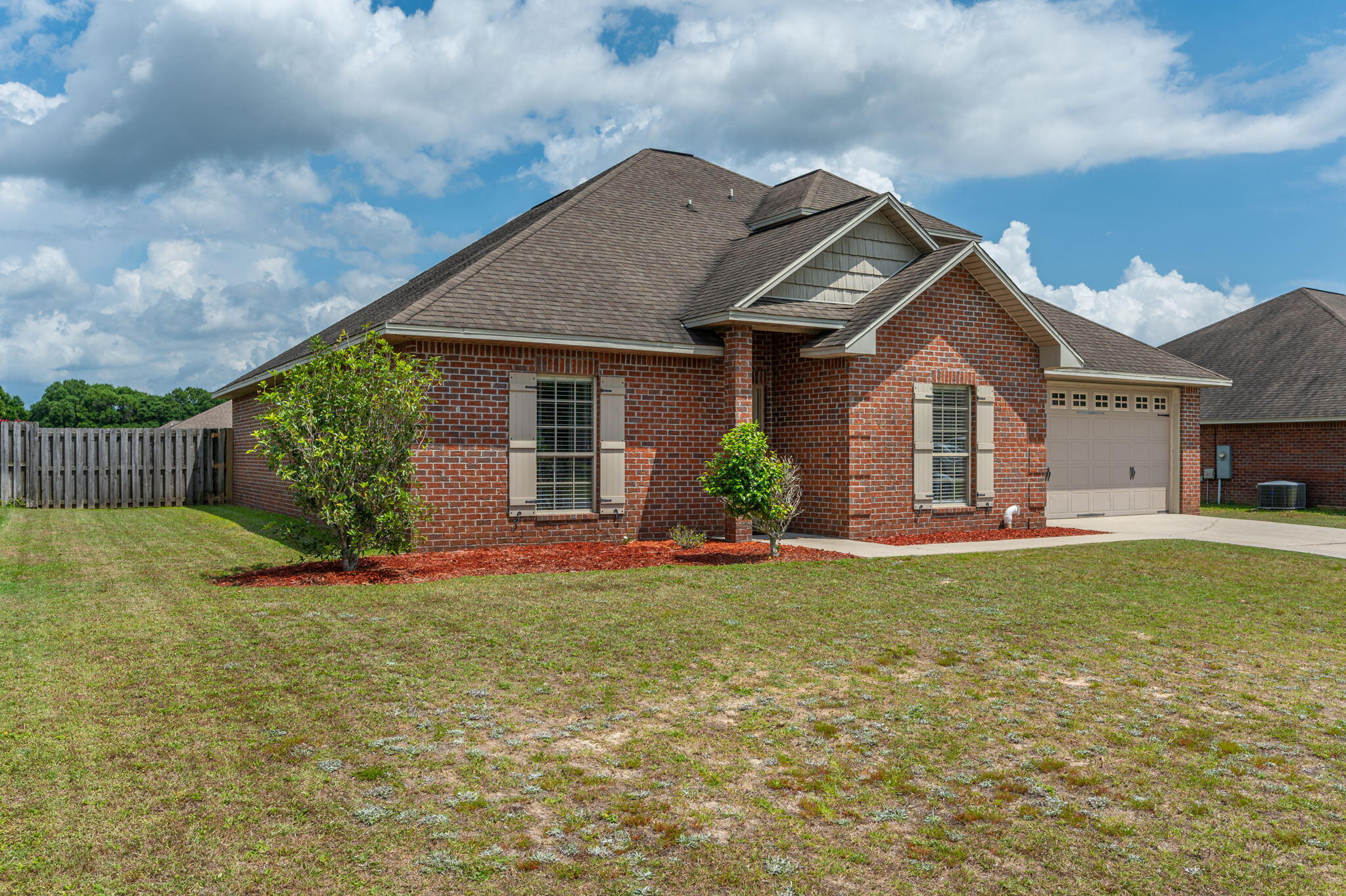 5231 Moore Loop Crestview, FL 32536 - Photo 2 of 45 a front view of house with yard and green space