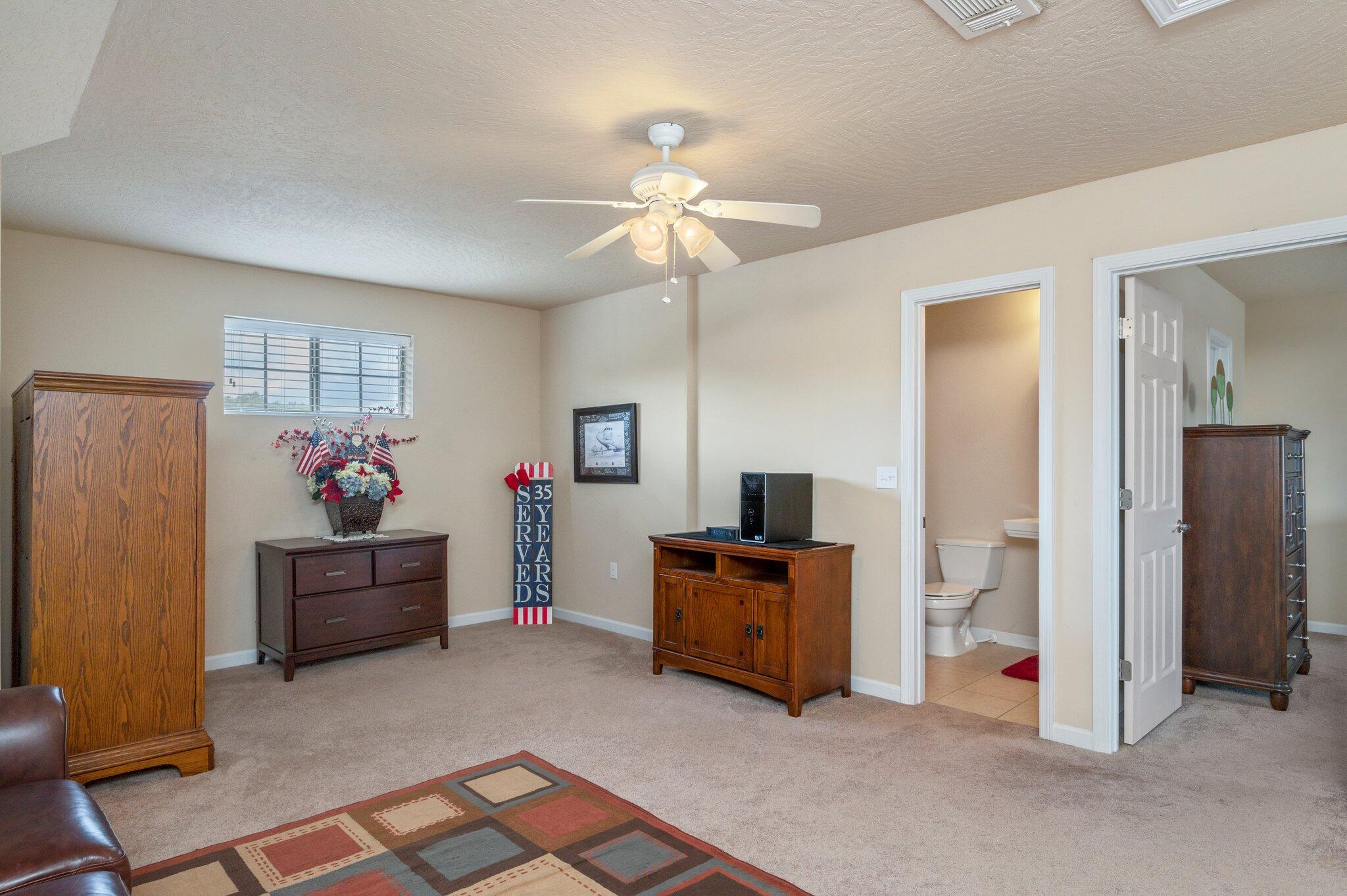 5231 Moore Loop Crestview, FL 32536 - Photo 24 of 45 a living room with furniture and a flat screen tv