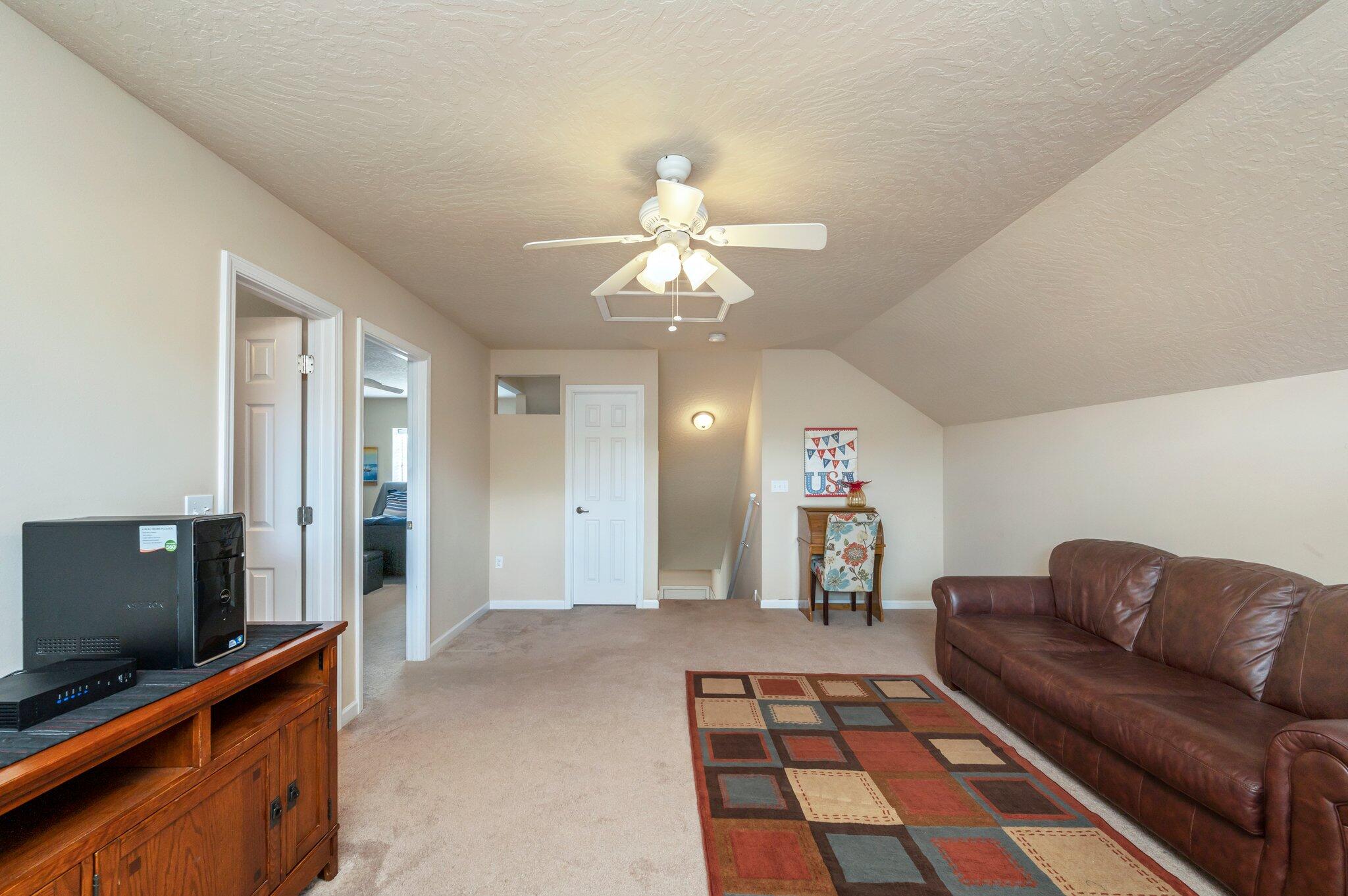 5231 Moore Loop Crestview, FL 32536 - Photo 25 of 45 a living room with furniture and a flat screen tv