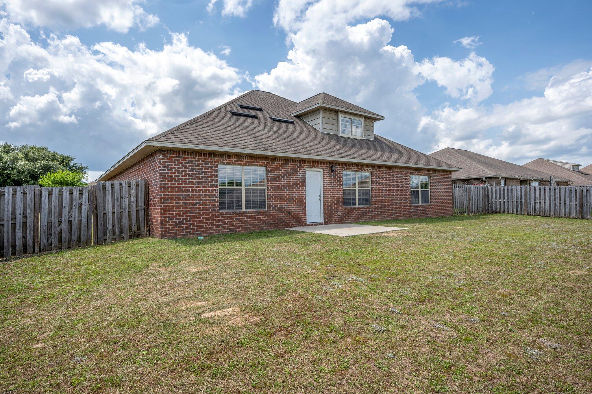 5231 Moore Loop Crestview, FL 32536 - Photo 39 of 45 a front view of a house with garden