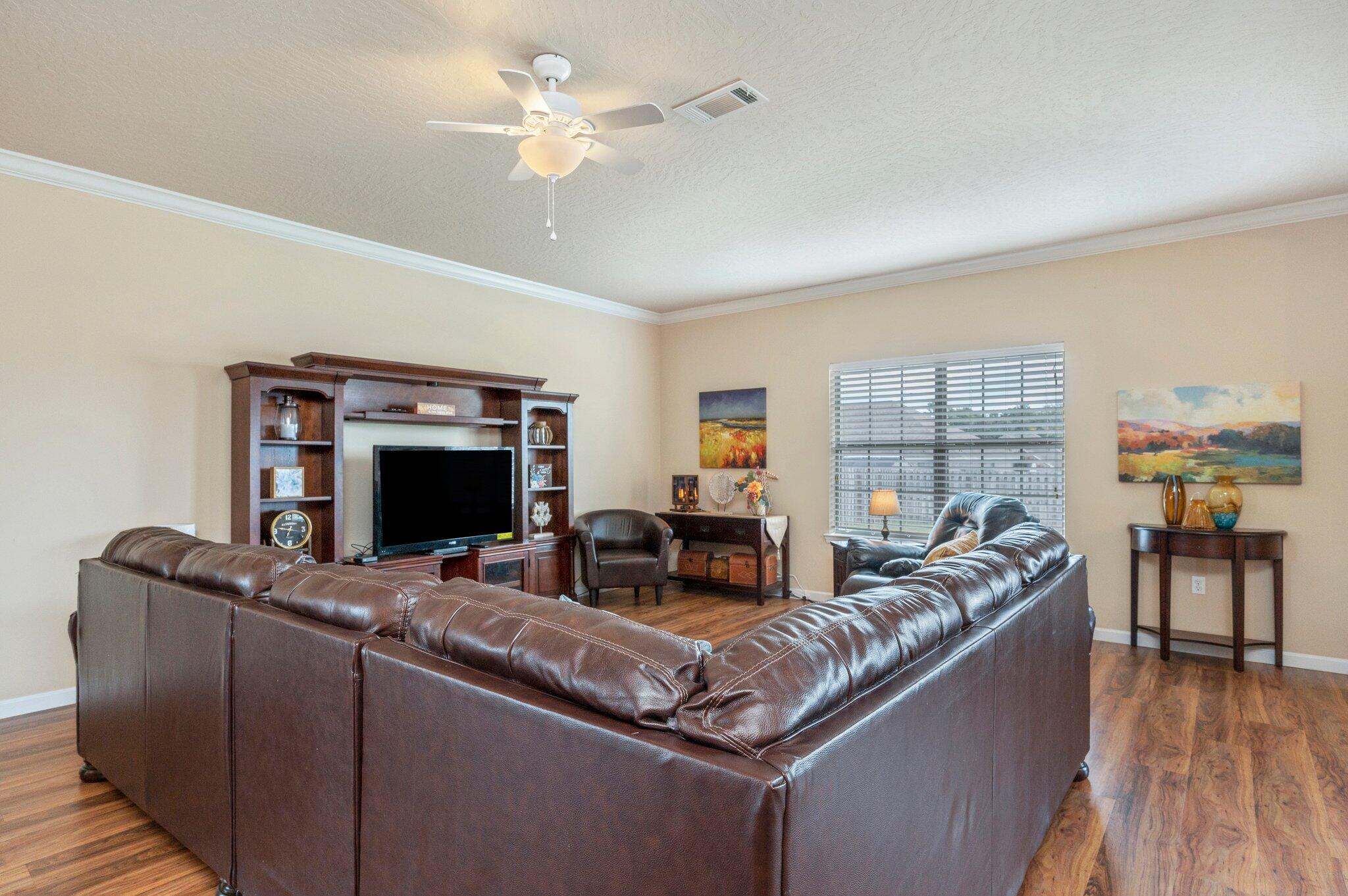 5231 Moore Loop Crestview, FL 32536 - Photo 5 of 45 a living room with furniture and a flat screen tv