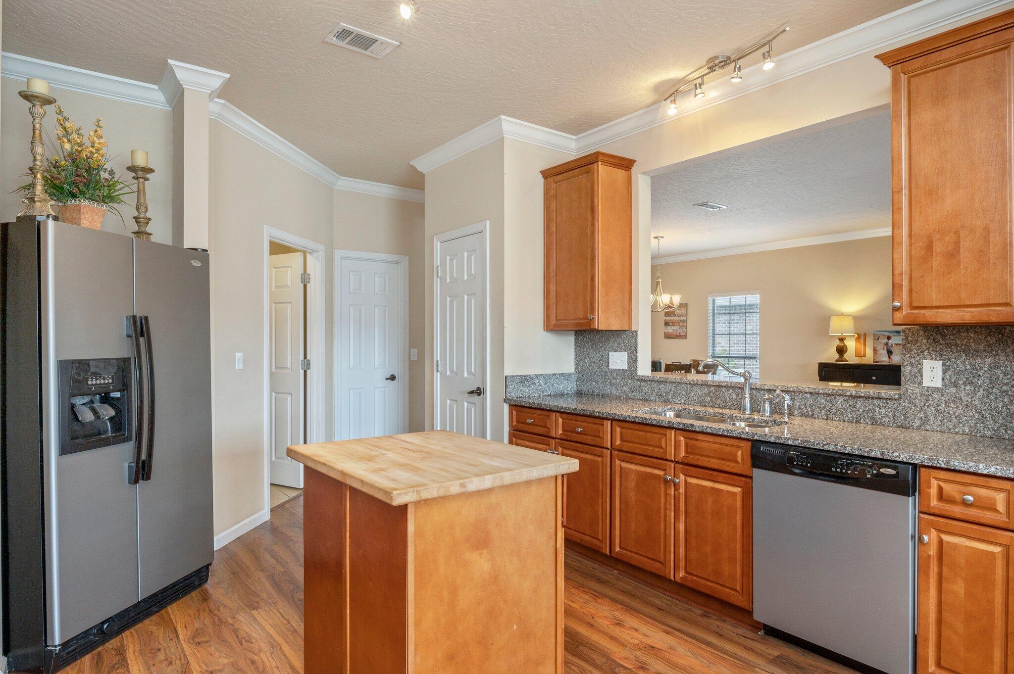 5231 Moore Loop Crestview, FL 32536 - Photo 9 of 45 a kitchen with stainless steel appliances granite countertop a refrigerator and a sink