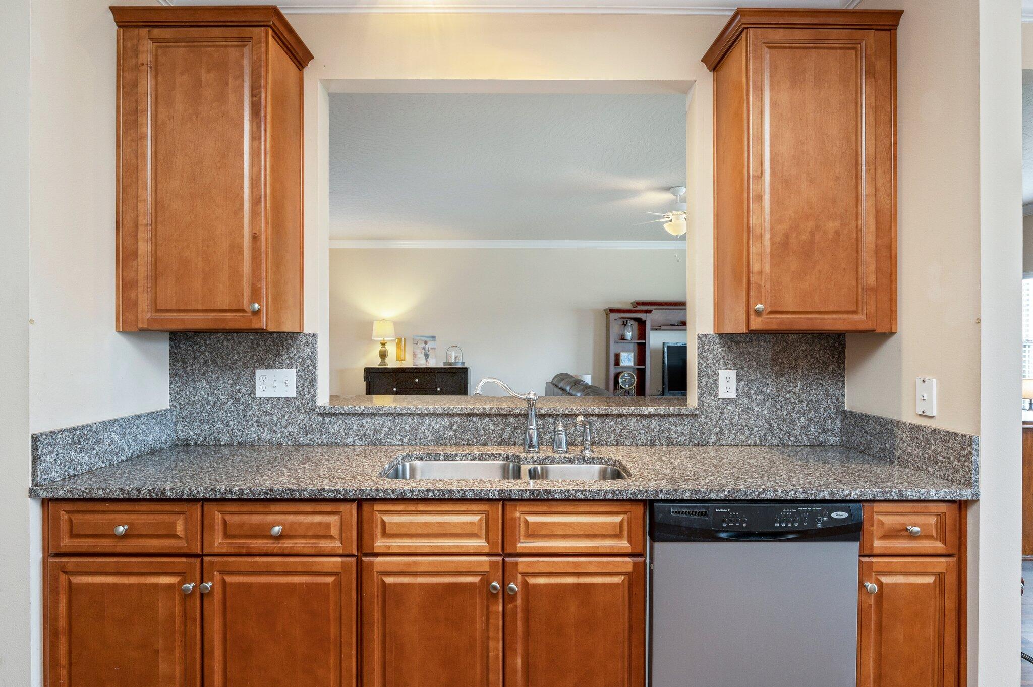 5231 Moore Loop Crestview, FL 32536 - Photo 10 of 45 a kitchen with granite countertop stainless steel appliances granite countertop a sink and cabinets