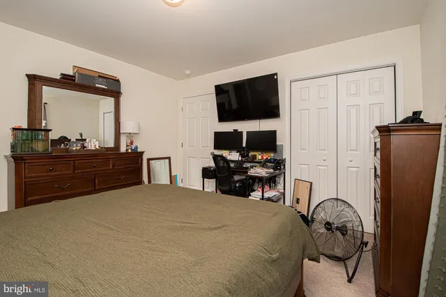 a bathroom with a sink a toilet and shower curtain