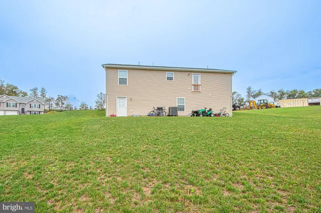 a view of a patio with table and chairs and potted plants