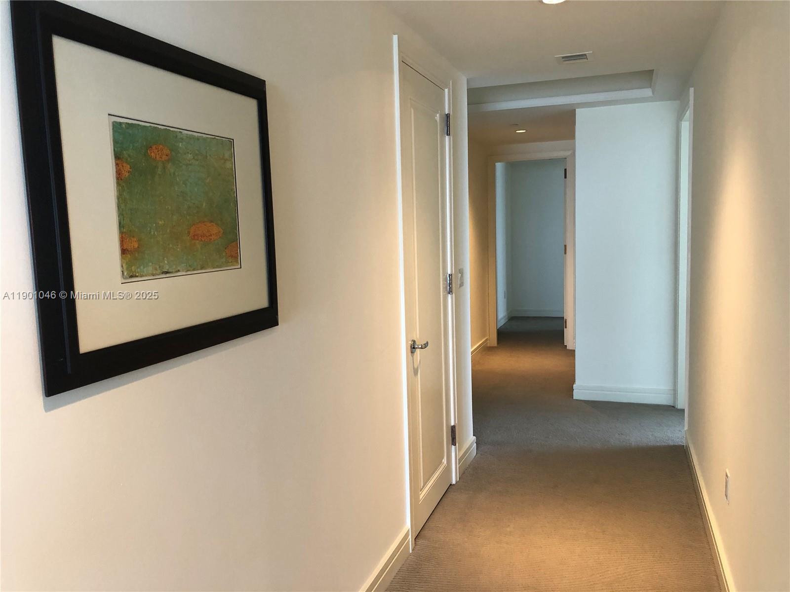 1435 Brickell Avenue, Unit 3506 Miami, FL 33131 - Photo 12 of 32 a view of a hallway with a hallway