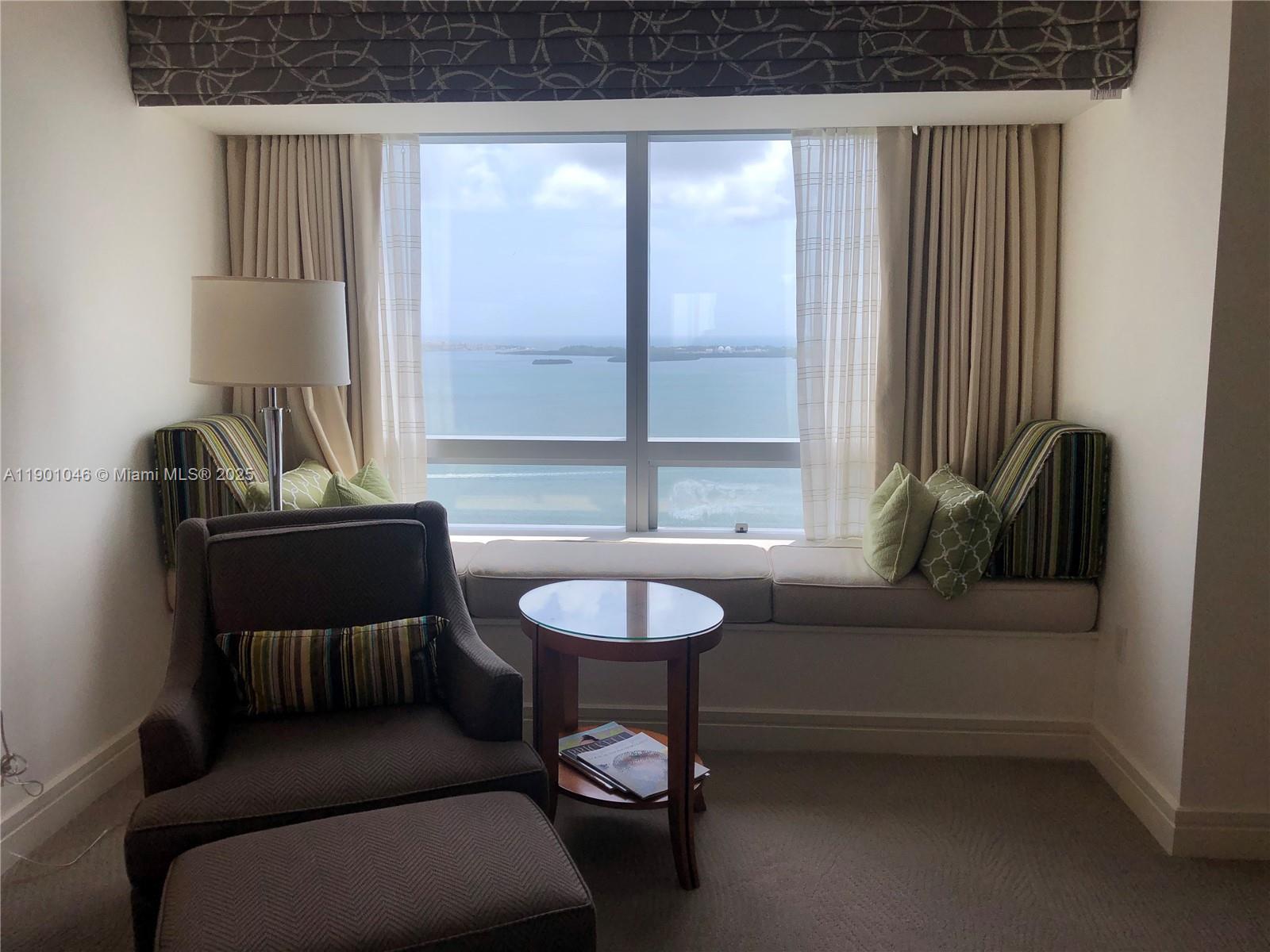 1435 Brickell Avenue, Unit 3506 Miami, FL 33131 - Photo 16 of 32 a living room with furniture and a potted plant