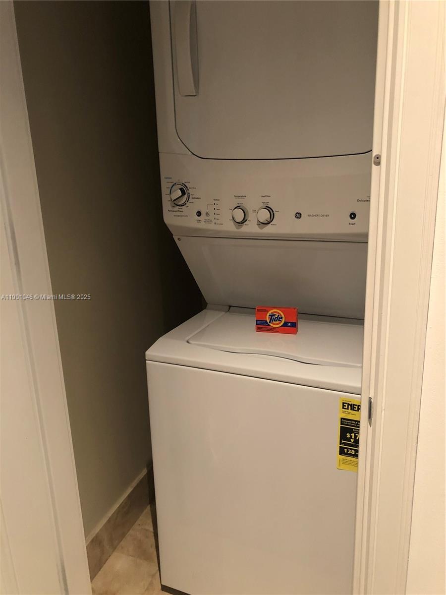 1435 Brickell Avenue, Unit 3506 Miami, FL 33131 - Photo 22 of 32 a utility room with dryer and washer