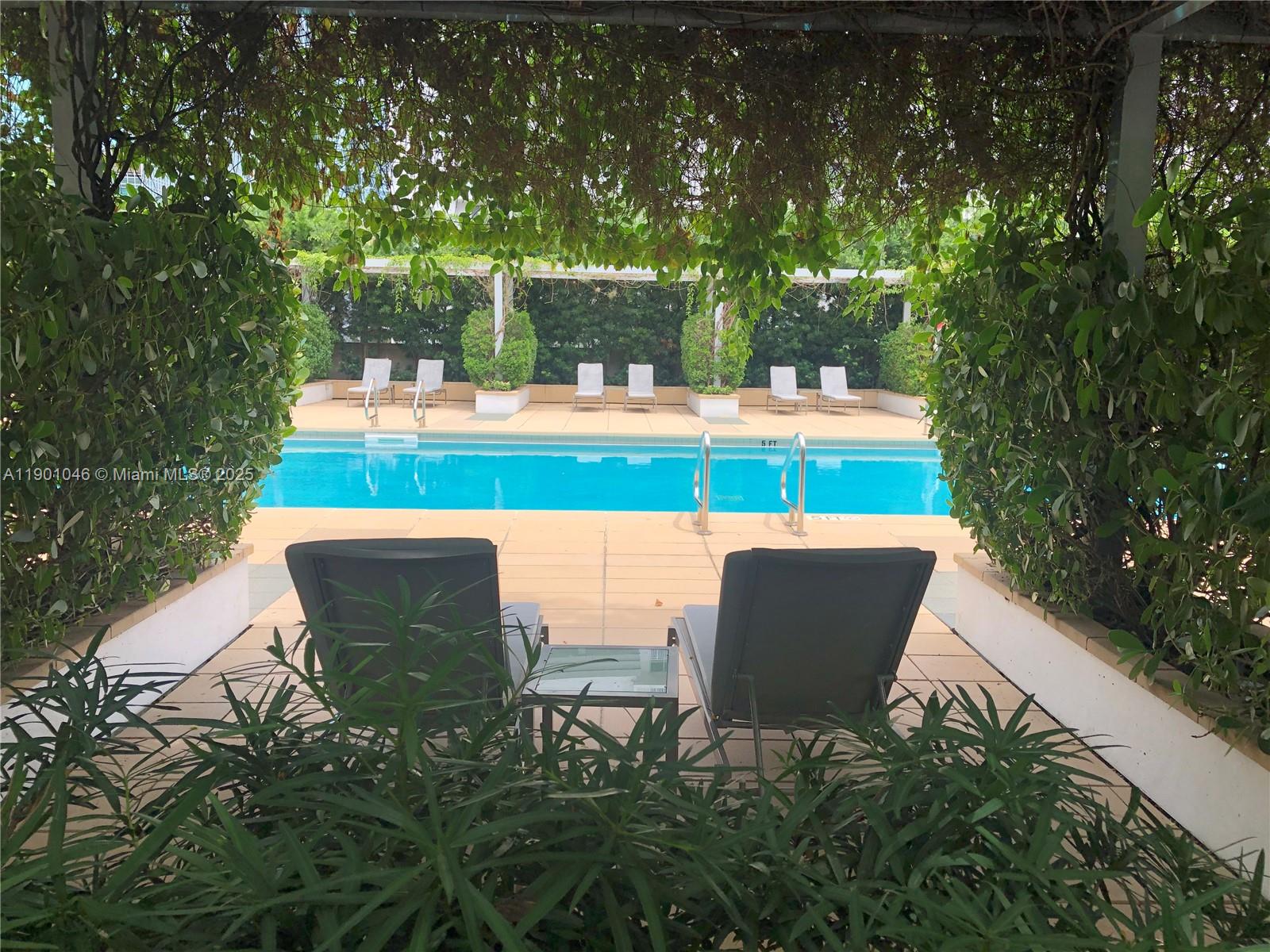 1435 Brickell Avenue, Unit 3506 Miami, FL 33131 - Photo 27 of 32 a view of a chairs and table in the garden