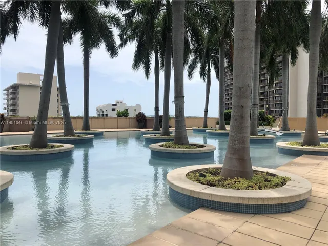 a swimming pool with outdoor seating and yard