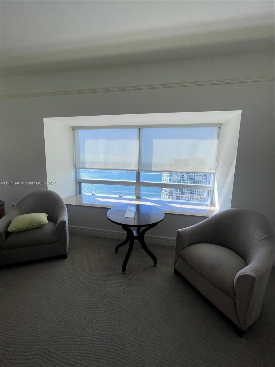 1435 Brickell Avenue, Unit 3506 Miami, FL 33131 - Photo 4 of 32 a living room with furniture and a window