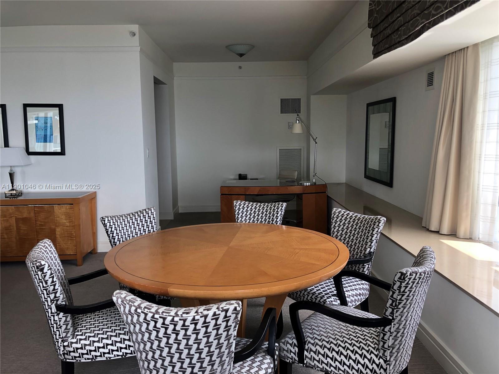 1435 Brickell Avenue, Unit 3506 Miami, FL 33131 - Photo 6 of 32 a balcony with table and chairs