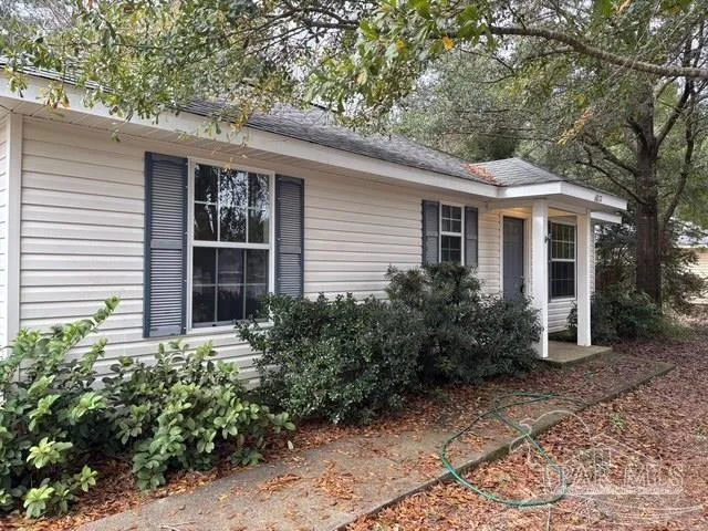 a house with a tree in front of it