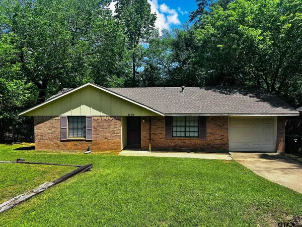 a front view of a house with yard