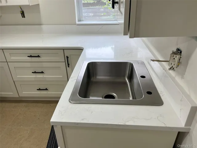 a bathroom with a sink and vanity