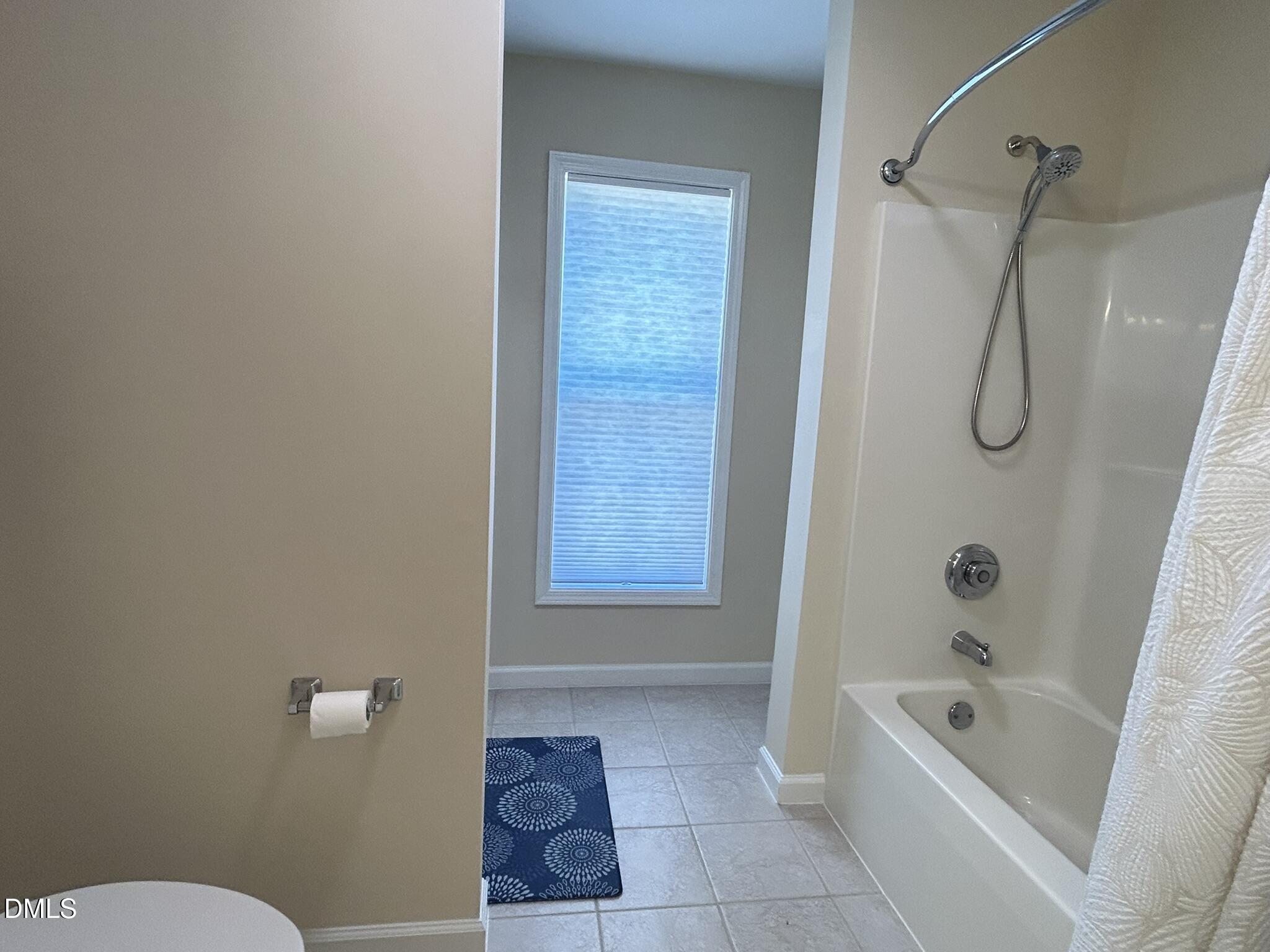 2510 Friedland Place, Unit 102 Raleigh, NC 27617 - Photo 40 of 42 a bathroom with a tub a toilet and a shower