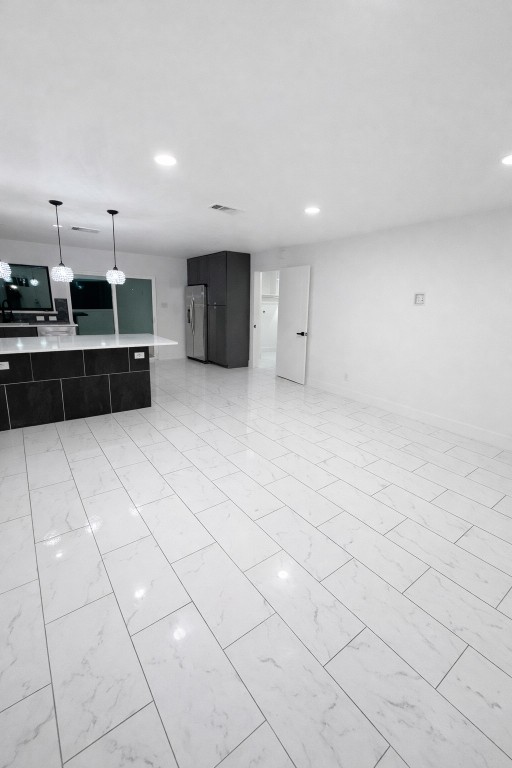 2014 Pecan Street Bastrop, TX 78602 - Photo 3 of 13 Unfurnished living room with light marble finish flooring